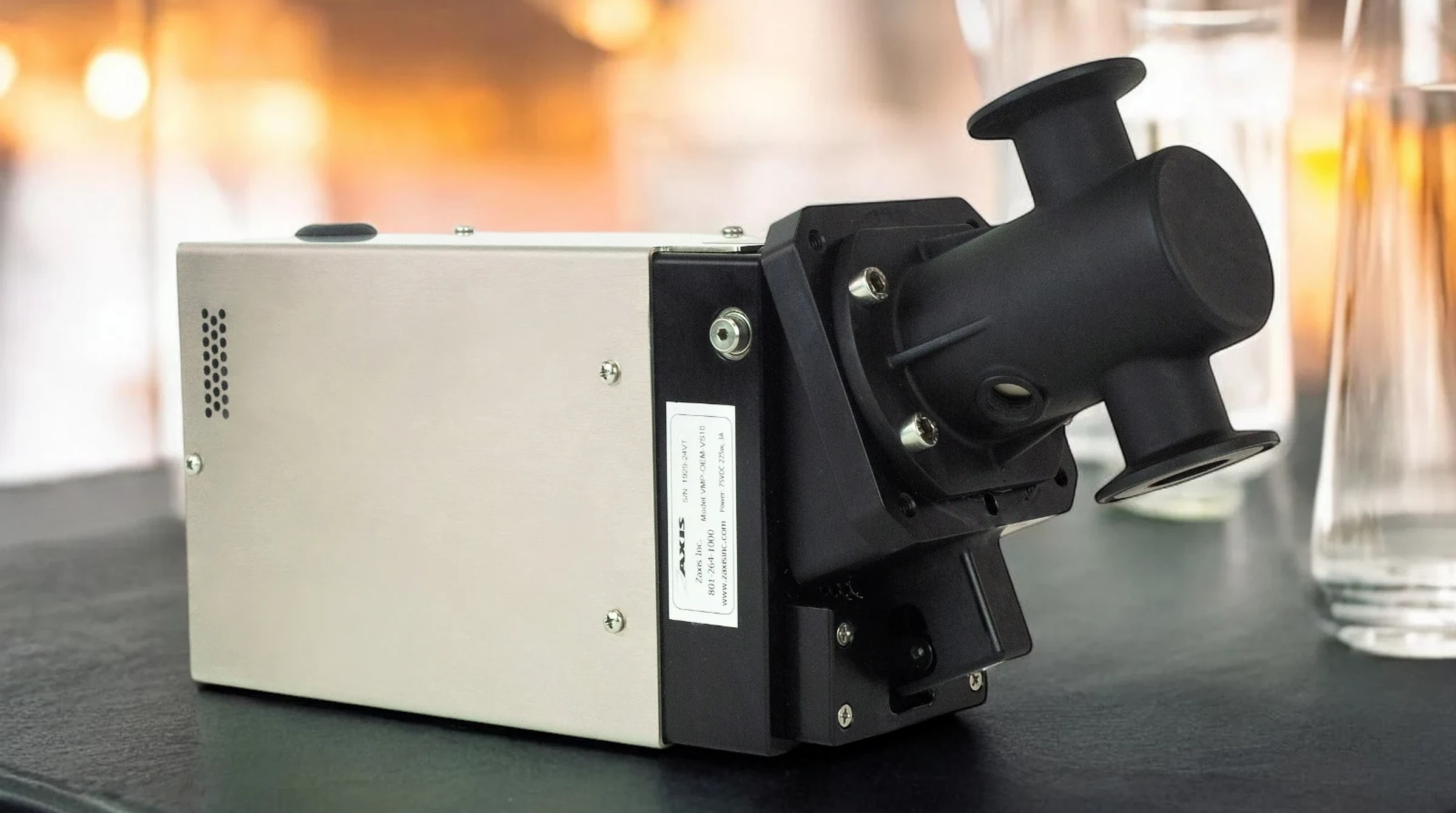 VS10-Series milliliter metering pump with molded pump head on a chemistry lab bench